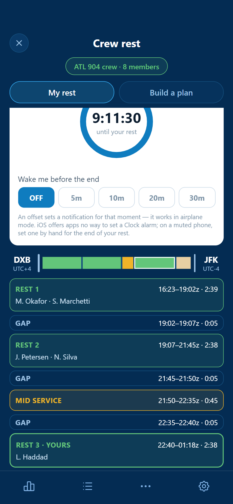 A crew member&rsquo;s own view of the plan: nine hours eleven until their rest, an optional wake-me offset that works in airplane mode, and the Dubai to New York timeline with three rest blocks, a mid service and the gaps between them, each with its times and the names in it.